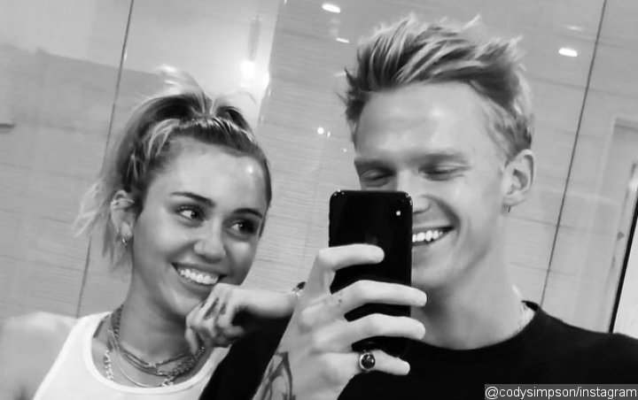 Miley Cyrus and Cody Simpson Get Matching Trident Tattoos