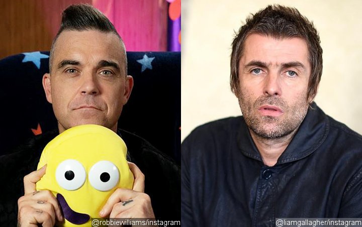 Robbie Williams Takes a Dig at Liam Gallagher Feud by Calling Him 'D**khead'