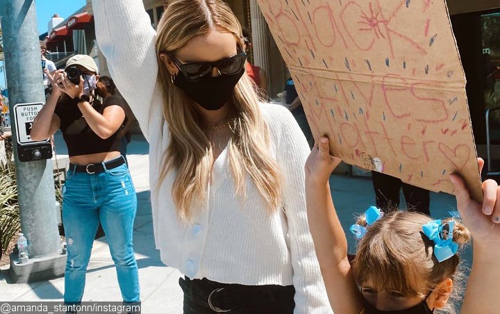 Amanda Stanton Claps Back at Hater Accusing Her of Using Daughters for Clout in Protest Pic