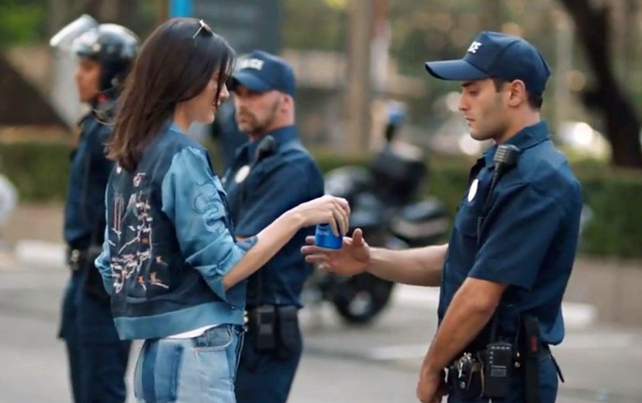 Protesters Mock Kendall Jenner's Pepsi Ad by Recreating It at Demonstrations