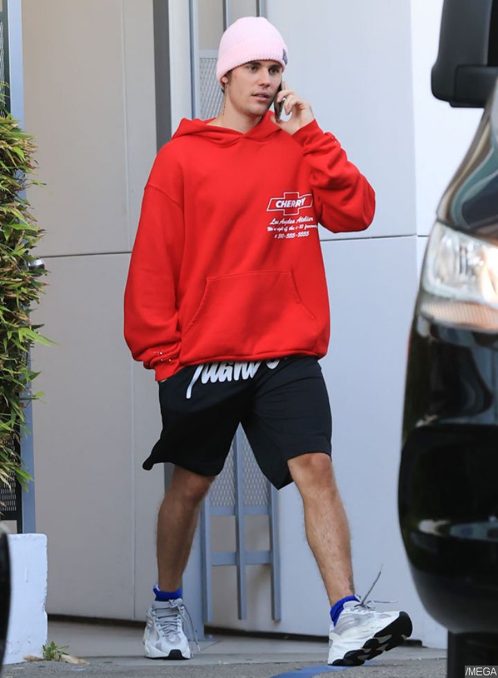 Justin Bieber looks sullen