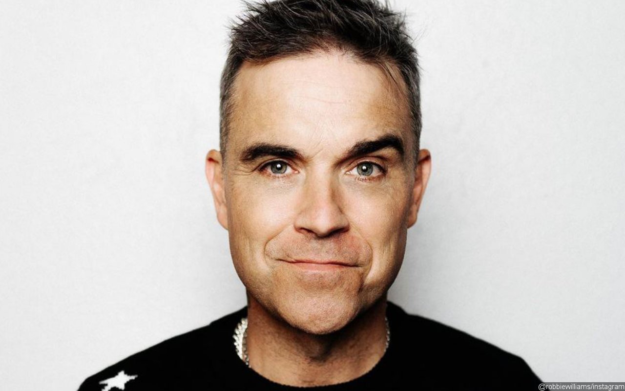 Robbie Williams Readying New Songs Under Different Moniker