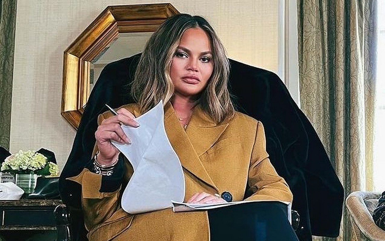 Chrissy Teigen Knocks Out Her Tooth While Eating Late-Night Snack