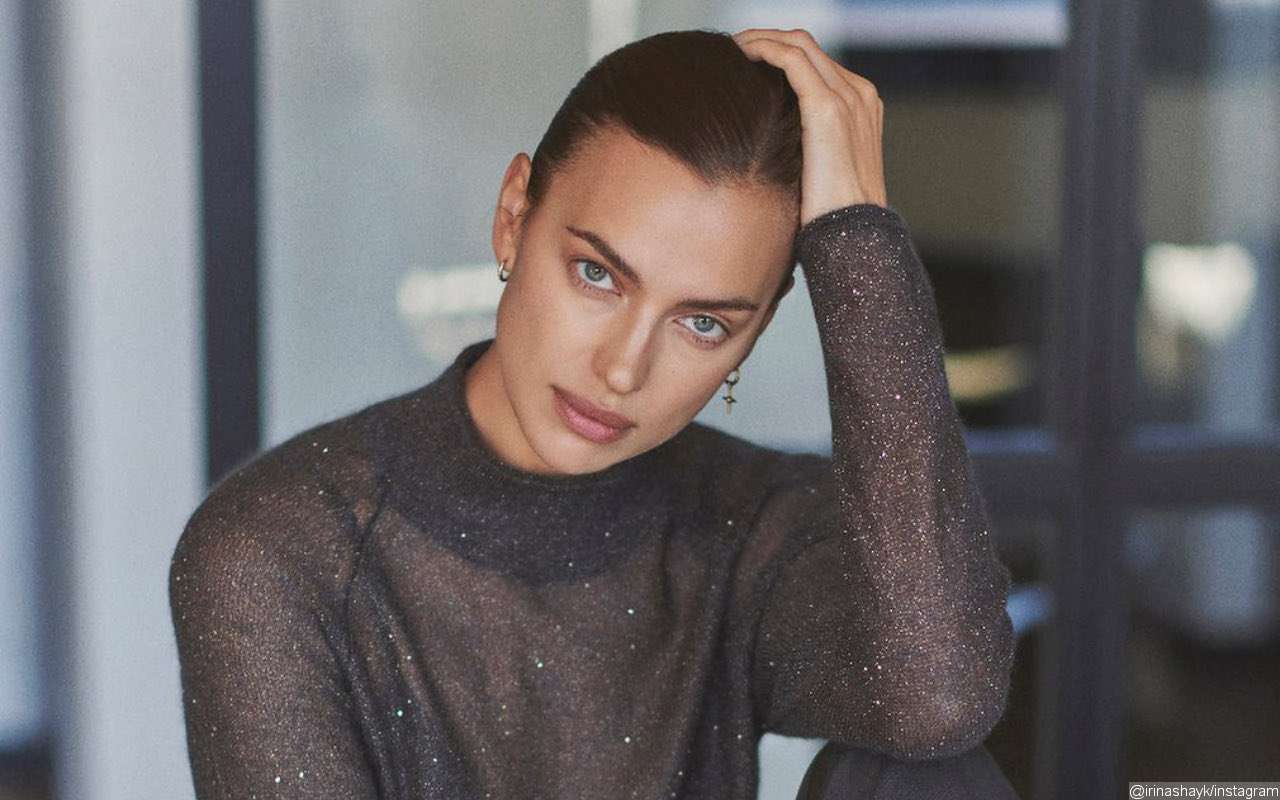 Irina Shayk Poses Seductively in Black Thong Jumpsuit