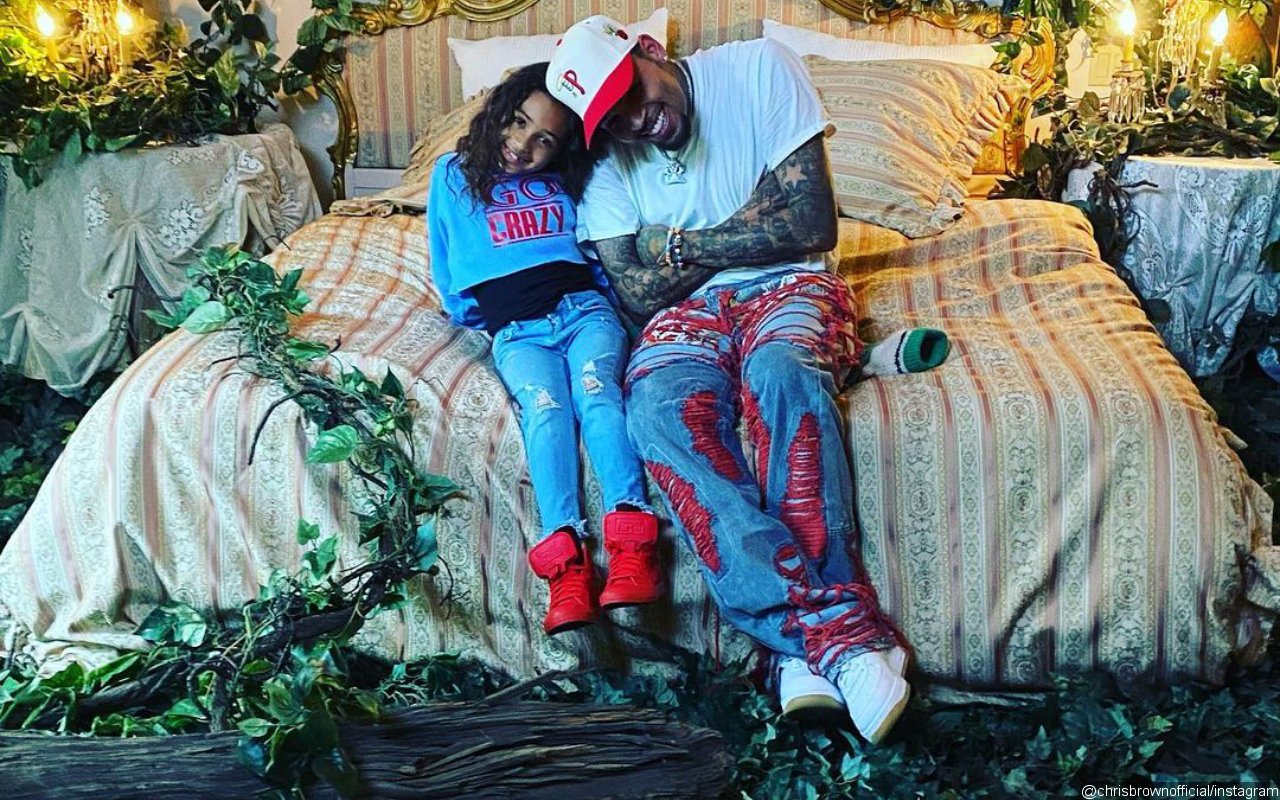 Chris Brown's Daughter Royalty Fearlessly Swims With and Cuddles Up to Baby Tiger