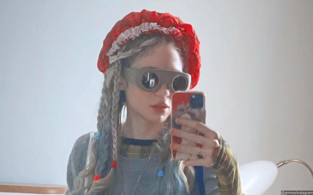 Grimes Goes Topless in Latest Social Media Post Weeks After Sparking Pregnancy Rumors