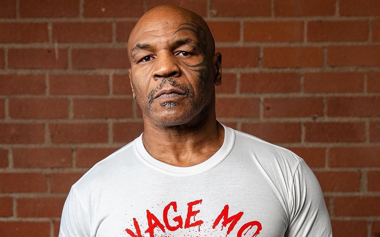 Watch Mike Tyson Throw Punches at Annoying Fan During Flight
