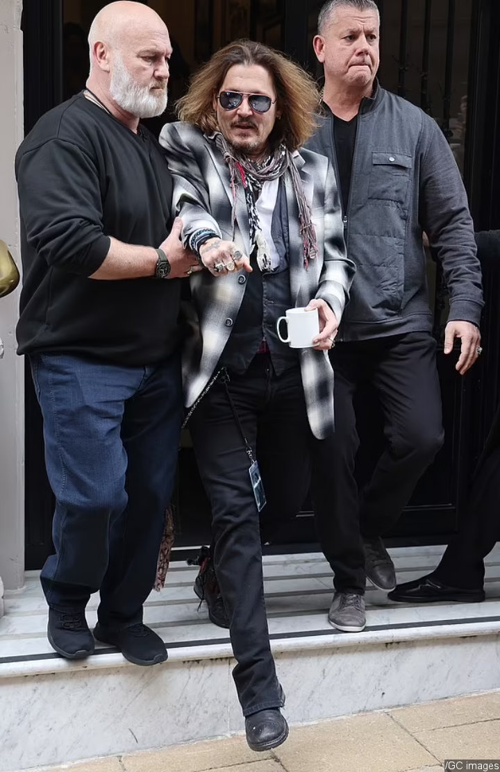 Johnny Depp Escorted Out a Hotel in Birmingham