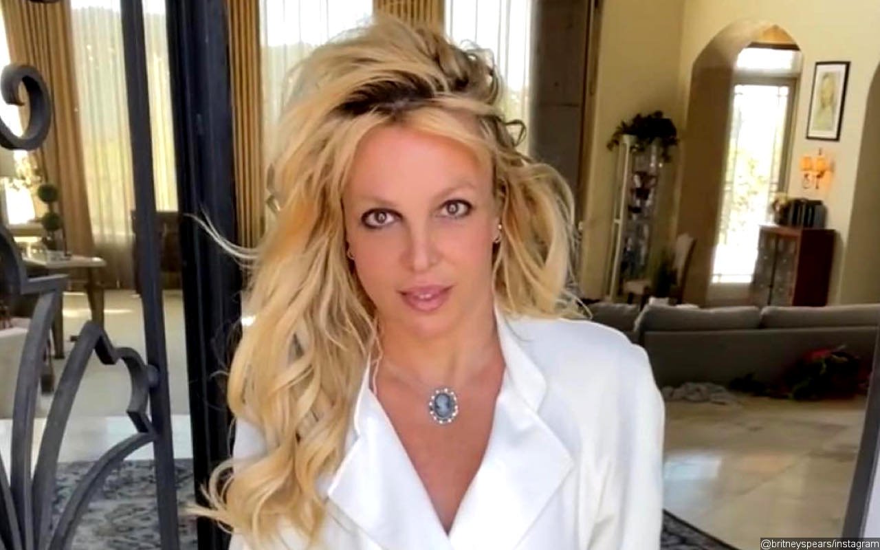 Britney Spears Clutches a Baby in New Pic After Miscarriage