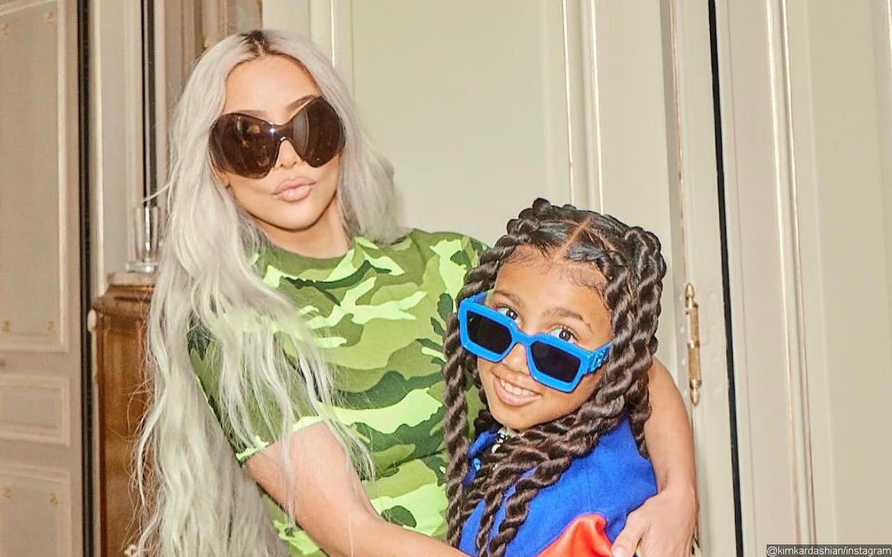Kim Kardashian Gets a Piggyback Ride From Daughter North West During Beach Vacation