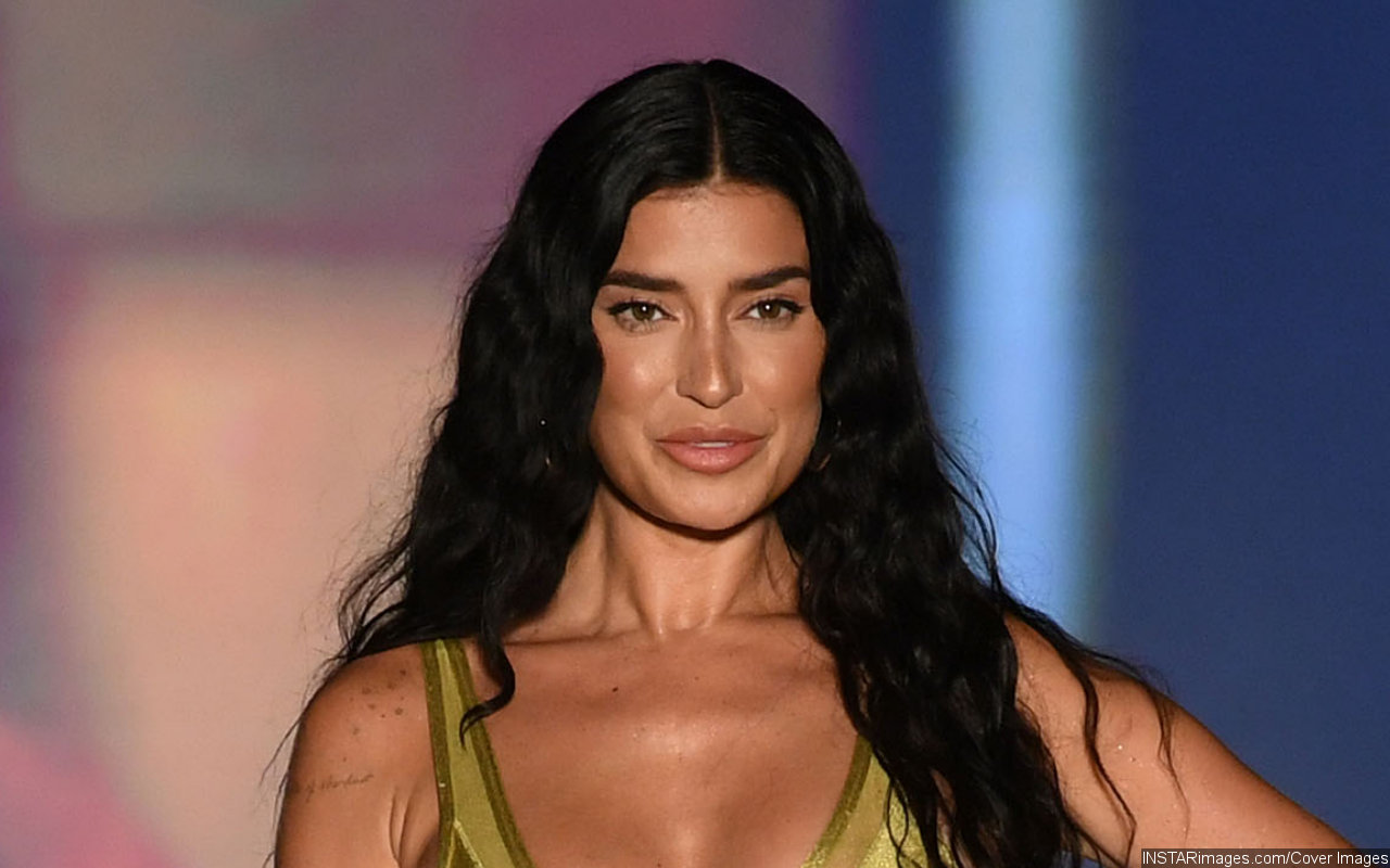 Nicole Williams Shows Off Baby Bump on Sports Illustrated Runway for