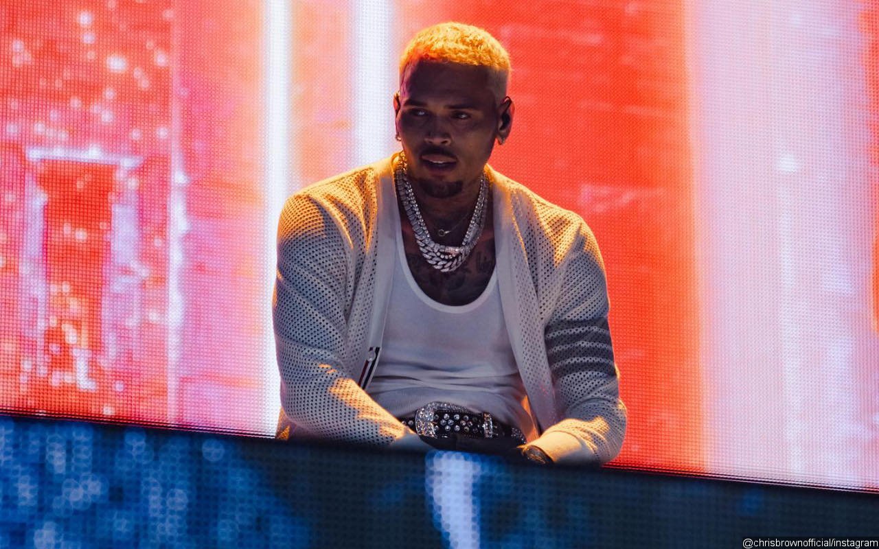 Chris Brown Laughs at Himself After Ripping Pants on Stage