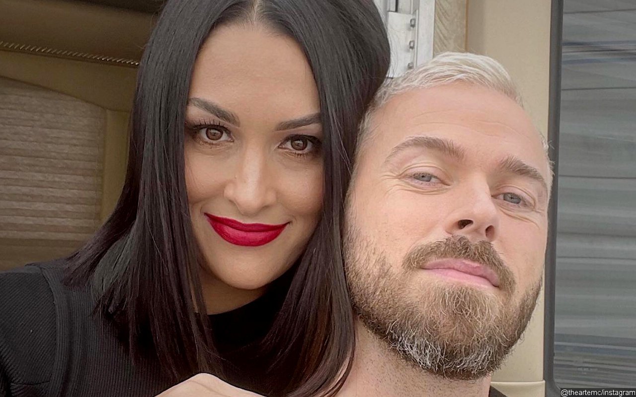 Nikki Bella and Artem Chigvintsev 'Can't Stop Smiling' as They're Finally Married