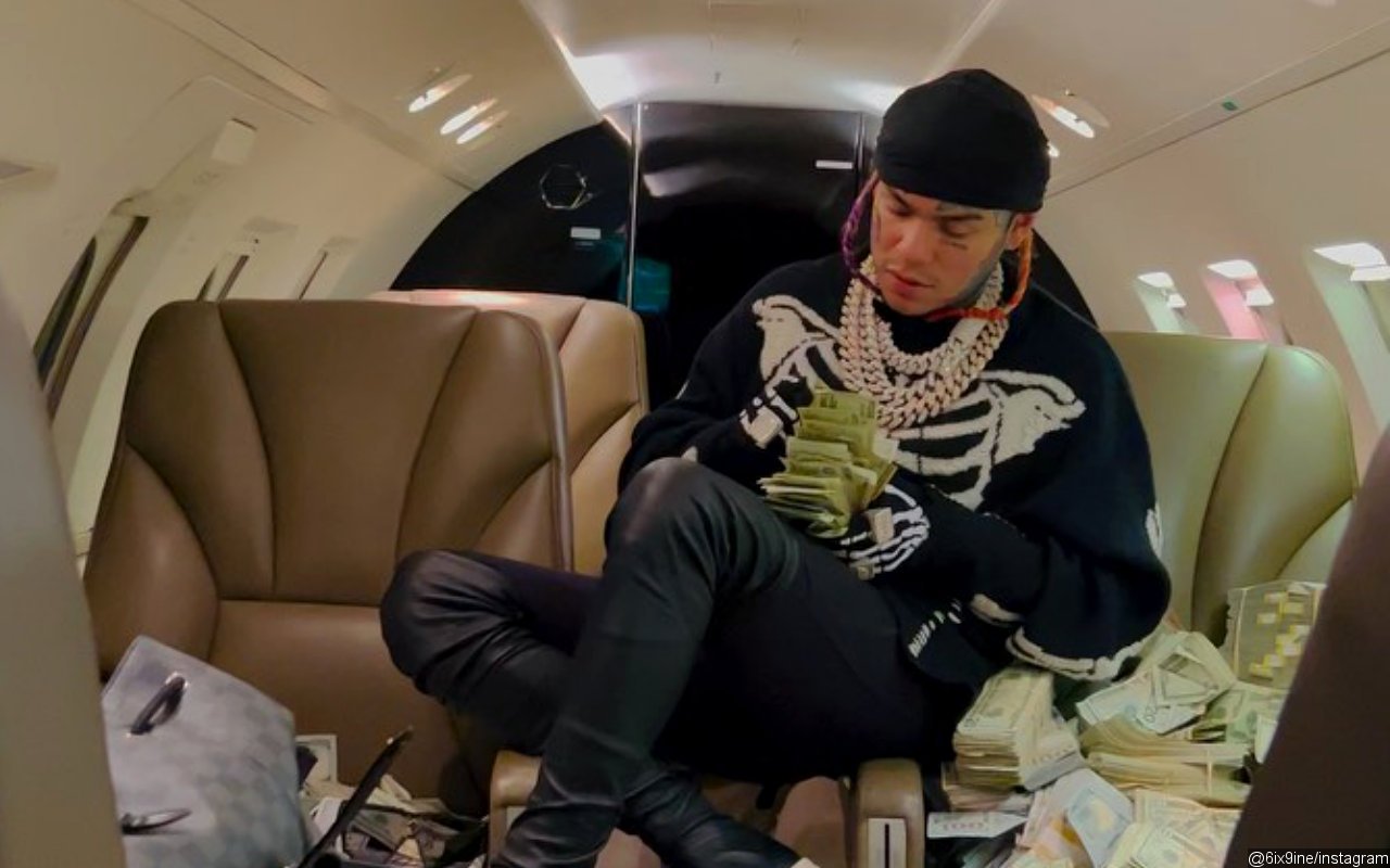 6ix9ine Leaves Fans Baffled After Revealing His Address While Flexing $1M in Cash
