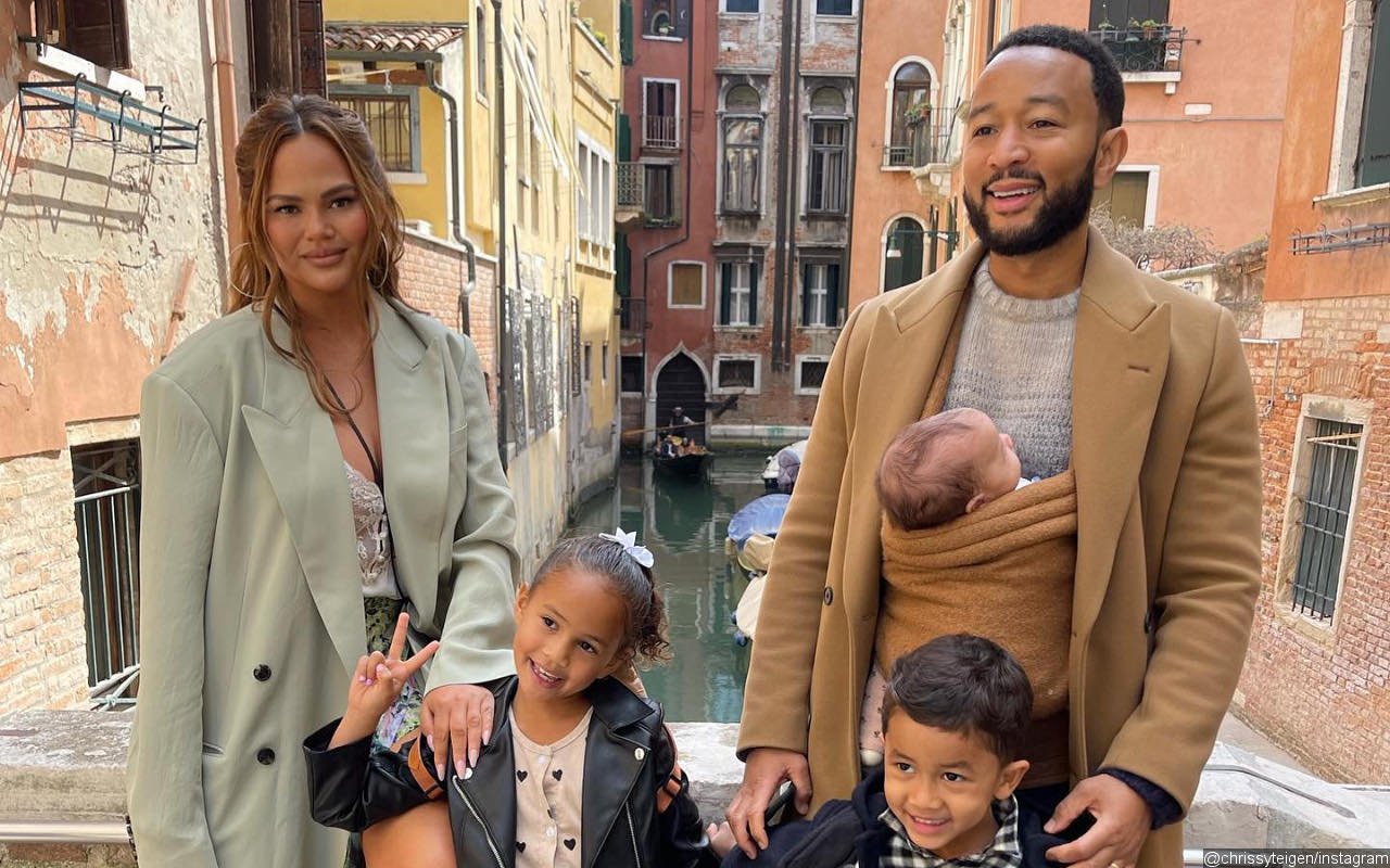 Chrissy Teigen Insists Daughter Esti Is 'Safe' in Defense of John Legend Using Baby Wrap