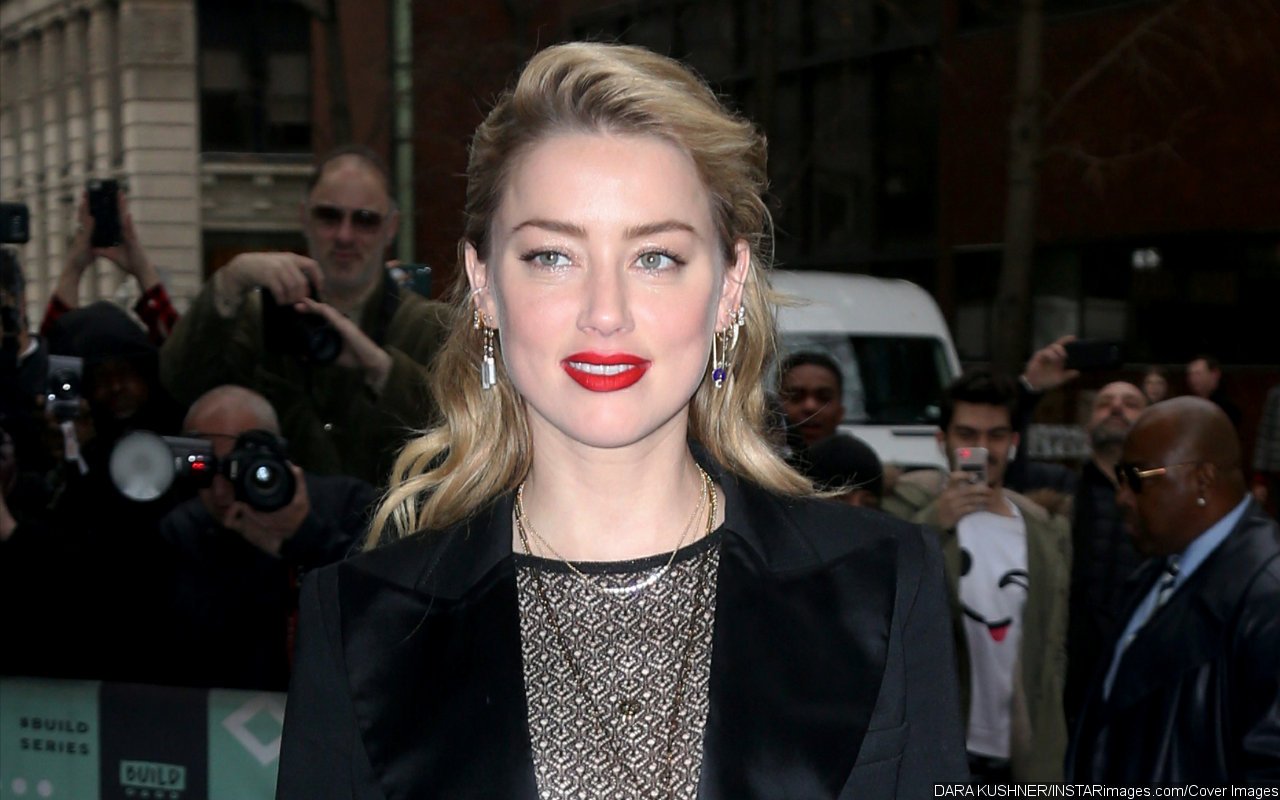 Amber Heard Happily Signing Autographs in Madrid Despite Report She Quits Hollywood