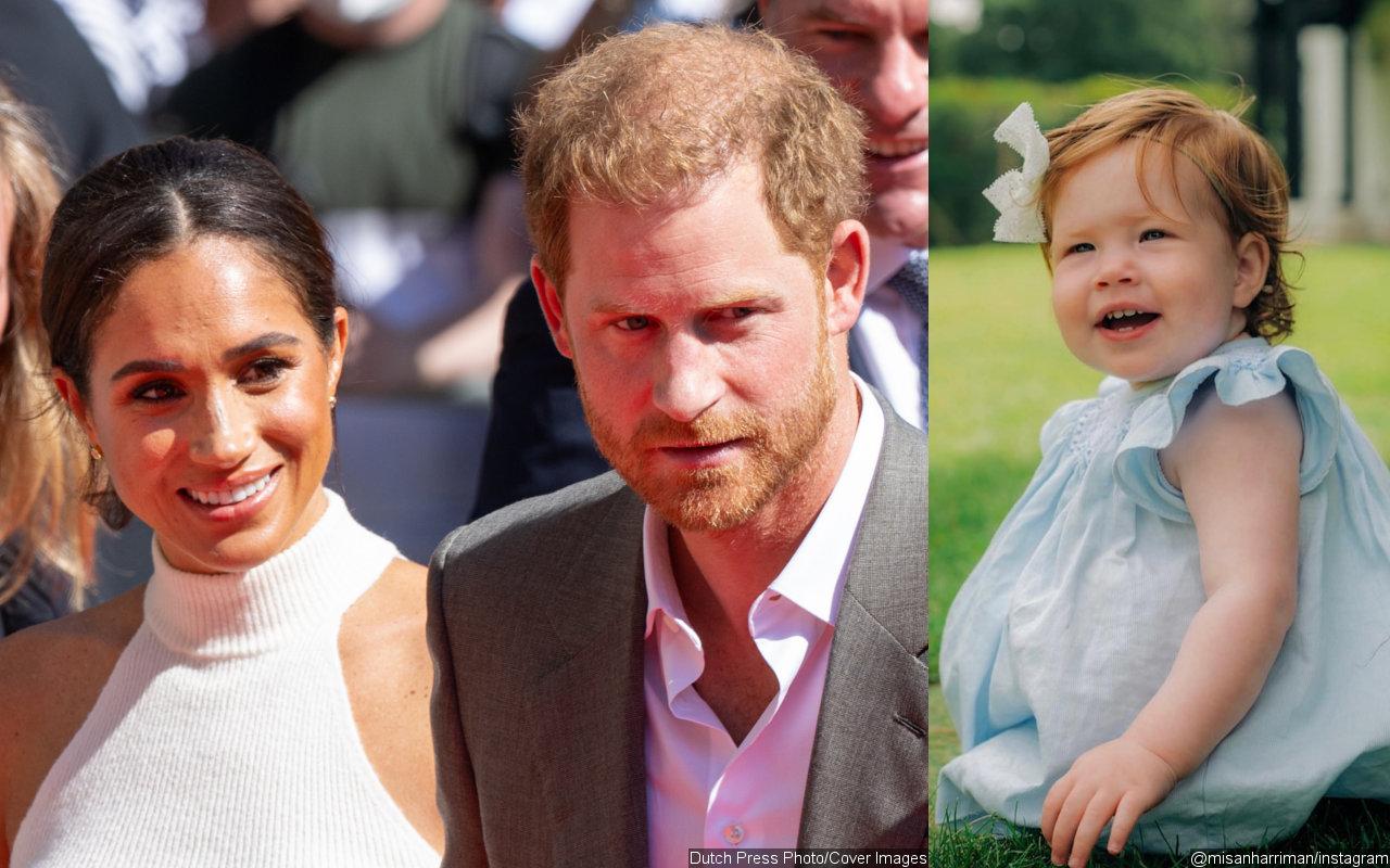 Prince harry cradles his and meghan markle s look alike daughter