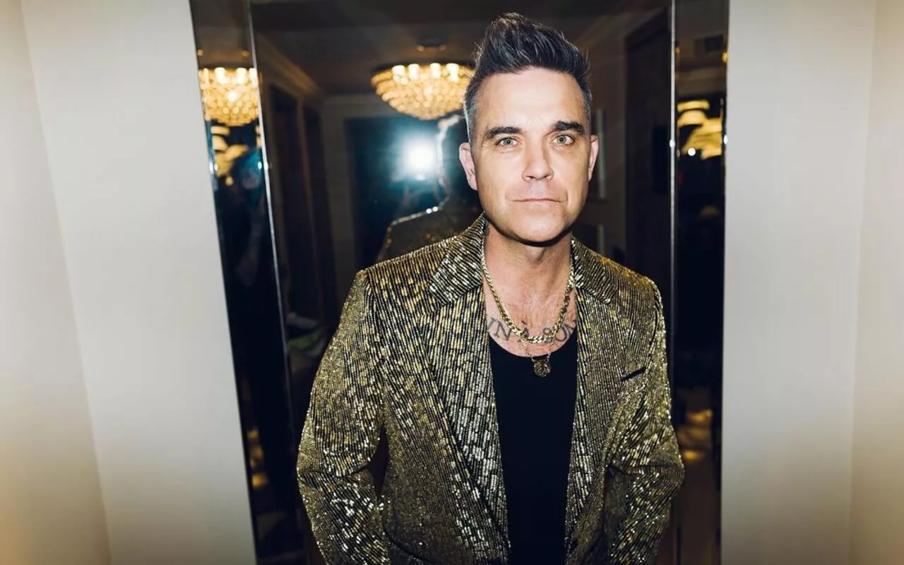 Robbie Williams Reveals Whether He's Ever Kissed His Take That Bandmates