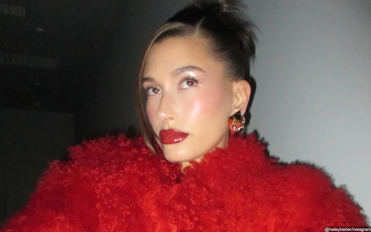 Hailey Bieber Showcases Curves in Wet White Dress in New Beach Photos