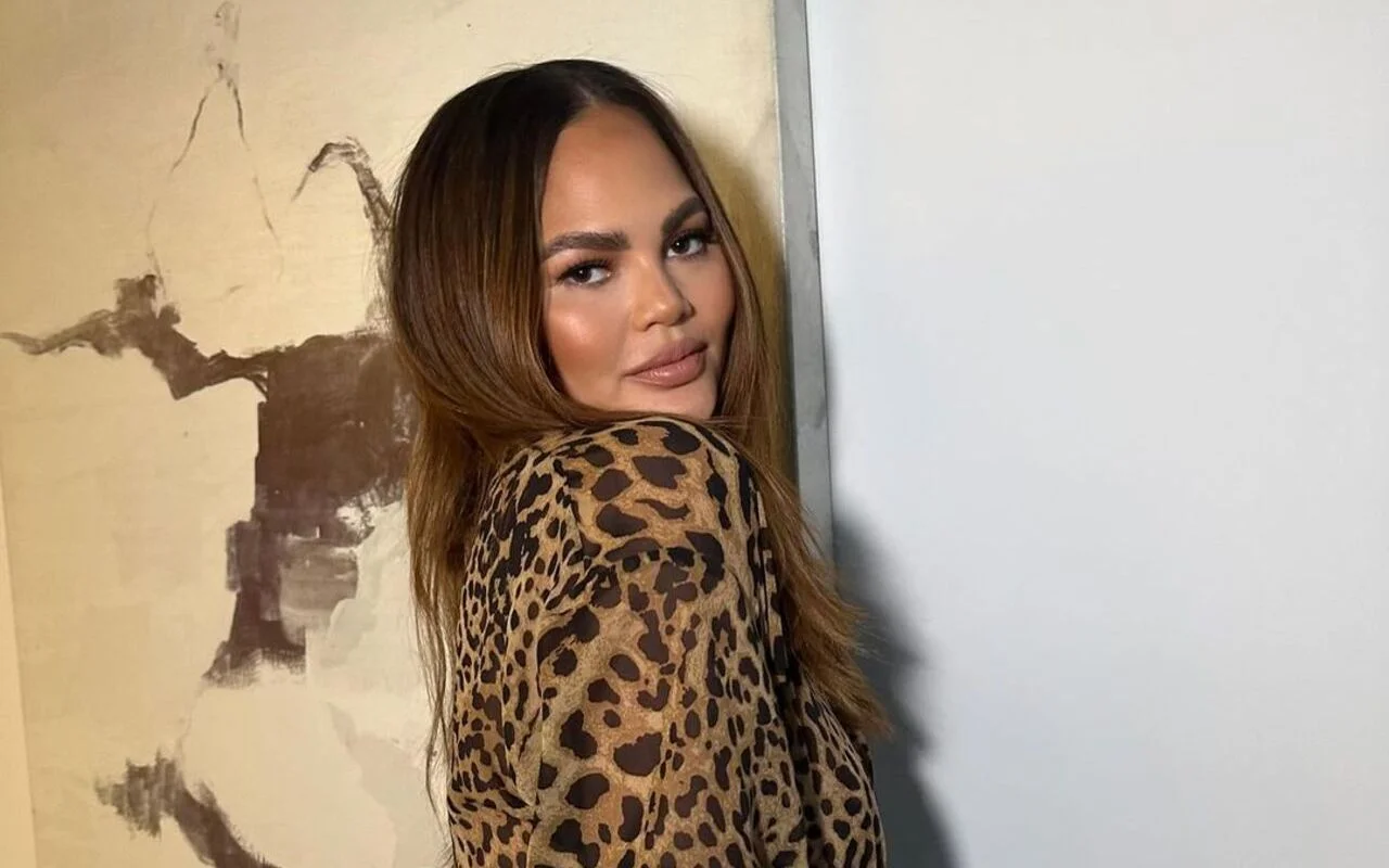 Chrissy Teigen Shares Pic of Neck Brace, Jokes About Her Absence From