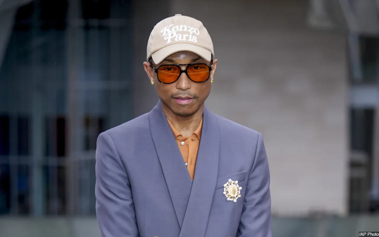 Pharrell's Attempts to Hug Rejected by Angry Animal Rights Activist Outside GQ Party