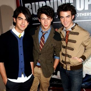 Jonas Brothers; in "Burning Up: On Tour With The Jonas Brothers" Book Party