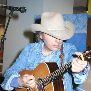Dwight Yoakam; in Dwight Yoakam Performs and Signs Blame The Vain his New Album