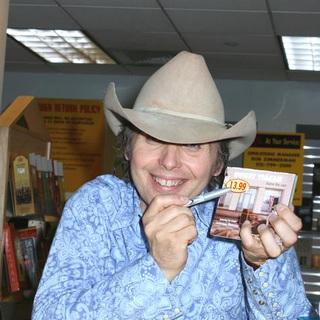 Dwight Yoakam; in Dwight Yoakam Performs and Signs Blame The Vain his New Album
