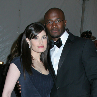 Taye Diggs;Idina Menzel; in Poiret, King of Fashion - Costume Institute Gala at The Metropolitan Museum of Art - Arrivals