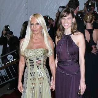 Donatella Versace;Hilary Swank; in Poiret, King of Fashion - Costume Institute Gala at The Metropolitan Museum of Art - Arrivals