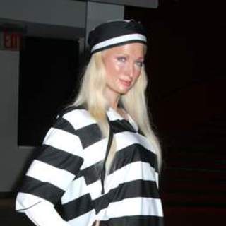 Paris Hilton; in Paris Hilton Jailbird Wax Figure at Madame Tussaud's Dons Black and White Striped Prison Garb