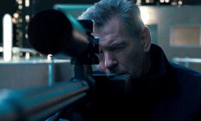 Pierce Brosnan Hired to Kill Milla Jovovich in 'Survivor' Trailer