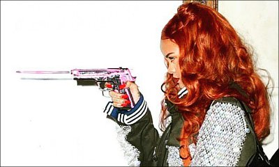 Rihanna Posts Daring Gun-Toting Photo on Instagram