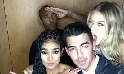 Gigi Hadid Bites Joe Jonas in Photo Booth Amid Dating Rumors