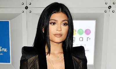 Kylie Jenner Wears Sister Kim-Inspired Plunging Black Gown for Sugar Factory Opening
