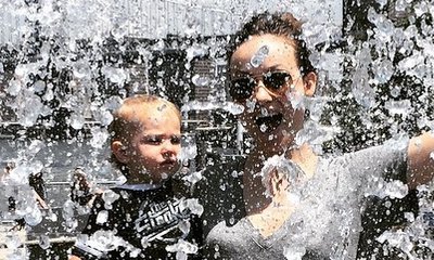 Olivia Wilde Posts Cute Picture With Baby Otis Surrounded by Jetting Water