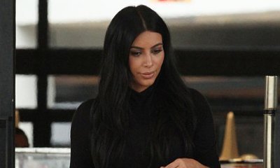 Pregnant Kim Kardashian Flaunts Curves in Skintight Black Dress