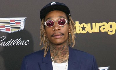 Wiz Khalifa Rides Hoverboard Again at LAX After Arrest