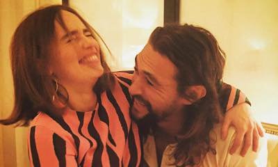 Emilia Clarke Cuddles Jason Momoa as They Reunite During Paris Fashion Week