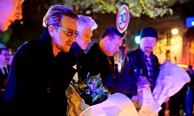 Bono and U2 Bandmates Lay Flowers at Paris Memorial After Deadly Attacks