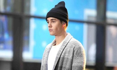 Who's That Girl? Justin Bieber Shares a Pic of Him and a Woman in Compromising Position