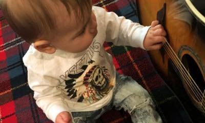 Kourtney Kardashian Shares Cute Photo of Baby Reign as Rock Star Wannabe