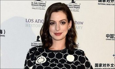 Anne Hathaway Shows Off Baby Bump on Red Carpet for First Time