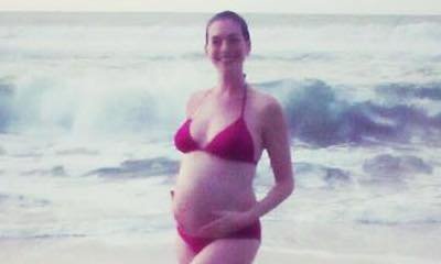 Anne Hathaway Shows Off Her Baby Bump in Bikini