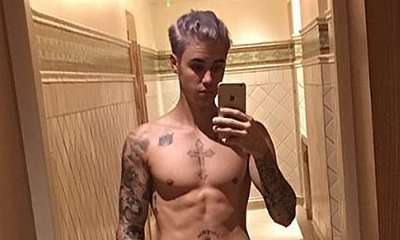 Justin Bieber Wears Only a Towel as He Shows Off His New Purple Hair