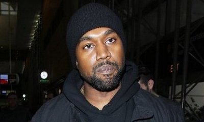 Kanye West Breaks Up Paparazzi Fight at LAX