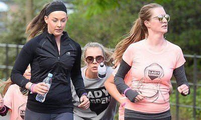 Cara Delevingne Takes Tumble During Charity Run With Sister Chloe In London