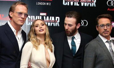 Chris Evans Can't Stop Staring at Elizabeth Olsen's Boobs at 'Civil War' London Premiere