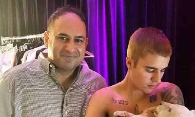 Justin Bieber Slammed by PETA for Posing With Lion Cub