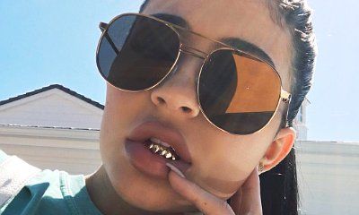 Kylie Jenner Shows Off Her New Accessory, Teeth Grills. Is She Copying Tyga?